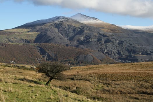 Mountain showing the historical site of industrial slate quarrying and mining.