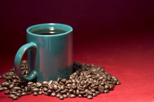 Green coffee cup full with beans