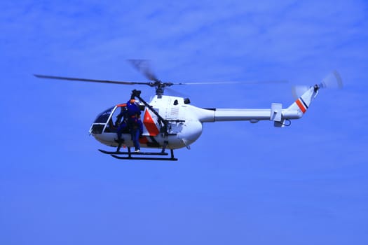 coartguard helicopter on a rescue mission demonstration
