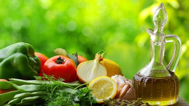 Olive oil with vegetables and condiments.