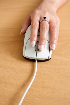 A businesswoman using a mouse