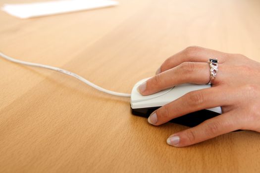 A businesswoman using a mouse