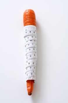 Carrot wrapped in measuring tape