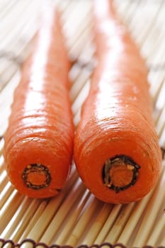 A couple of carrots on bamboo