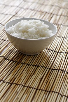 A bowl of rice on bamboo