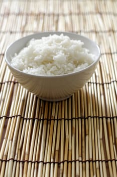 A bowl of rice on bamboo