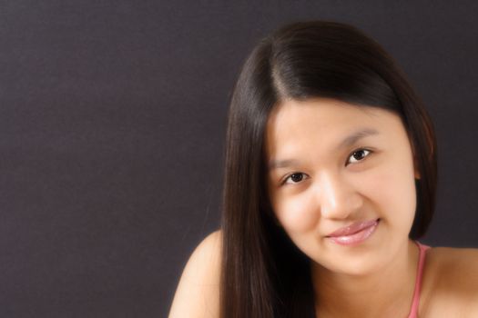 Portrait of a pretty woman with black background