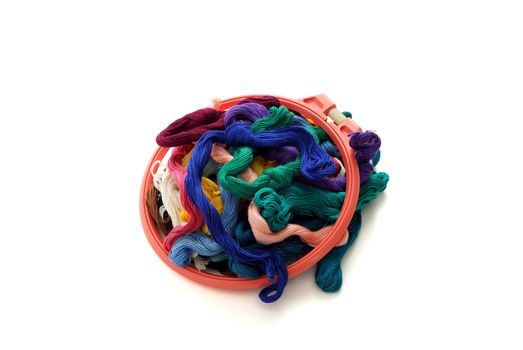 Colorful embroidery floss with small red tambour