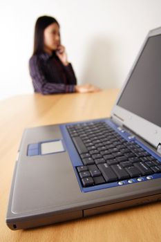 A businesswoman and laptop at office