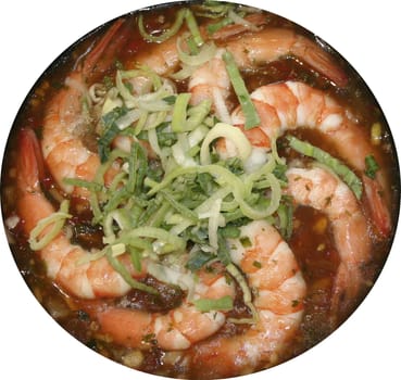 Shrimps on a frying pan about a leek