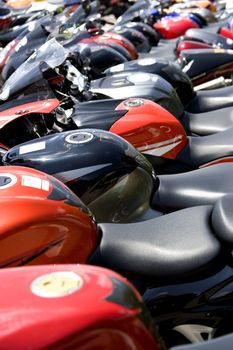 Image of parked motorcycles in a row.