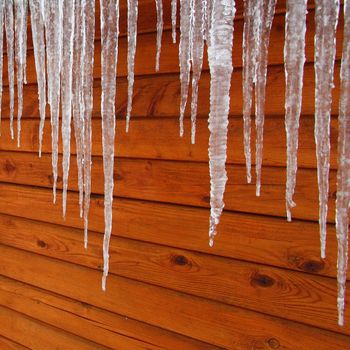 Icicles hang from a wood cabin in on a chilly winter day in northern Illinois.