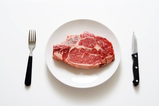 Raw steak on a plate