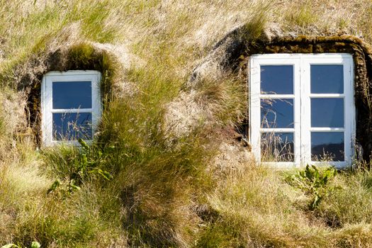Iceland - typical mossy farme, two windows.