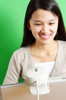 A businesswoman using a webcam