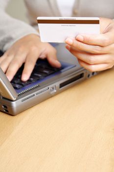 A businesswoman making an online purchase