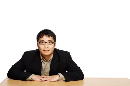 Businessman posing in an office, with copy space