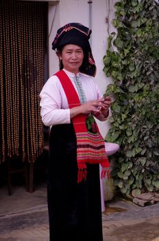 Woman of the Thai ethnic group in traditional dress at the market of Dien Bien Phu