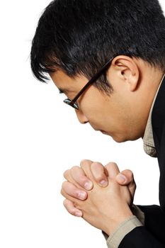 Businessman in suit praying