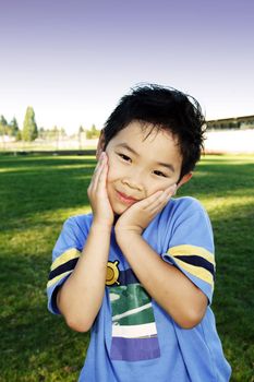 A cute boy posing outdoor