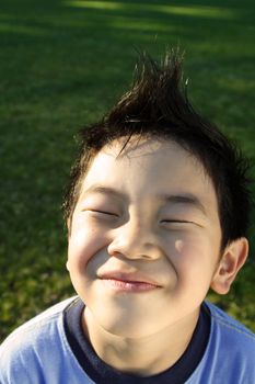 A happy kid daydreaming outdoor