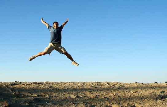 A happy man jumping in the air