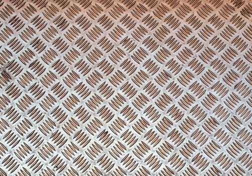 Diamond steel plate useful as a background