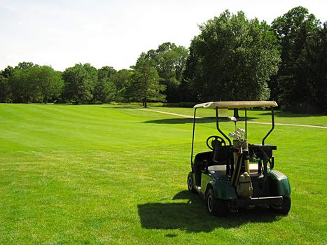 A photograph of a golf cart on a golf course.