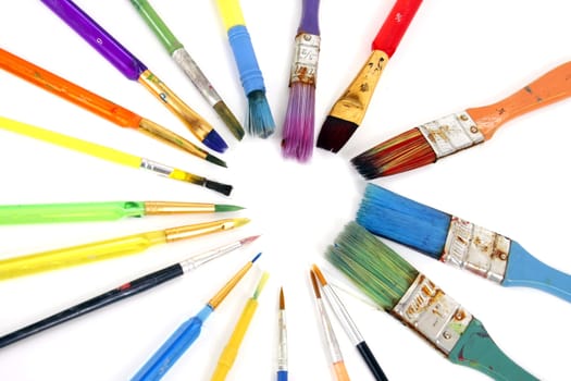 clorful paintbrushes of different sizes in the shape of a heart