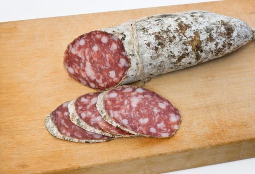 salami sliced on cutting board