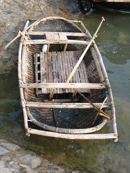 Boat 3 to 4 meters long woven bamboo coated with tar to waterproof. Barque typical of Vietnam