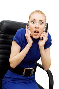 Busy and shocked businesswoman with two phones over white