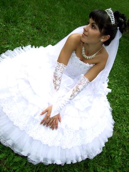 beautiful young bride on holiday in the park