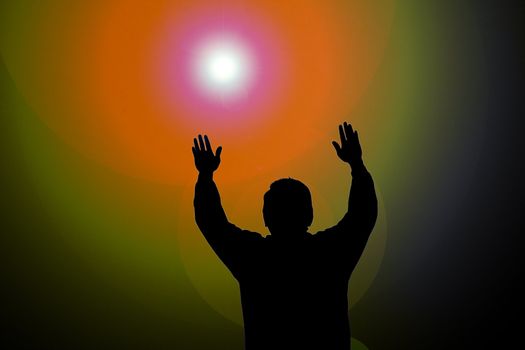 Colorful sun beam on man with hands up