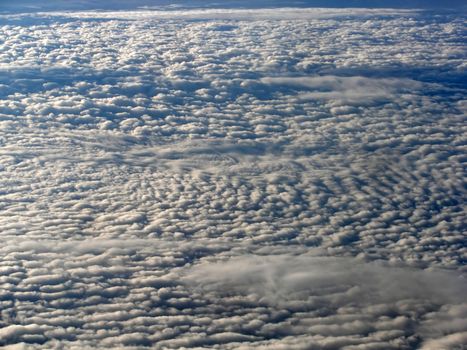 View of a lot of Clouds from an airplane 