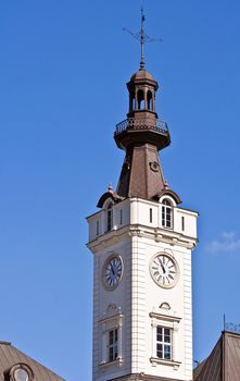 Image of a clock tower under clear blue sky.