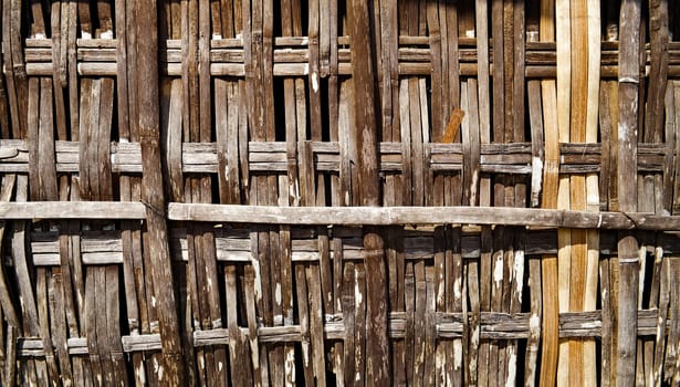 Close up on a bamboo fence tied up