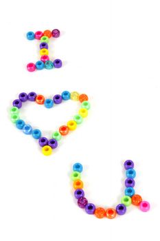 Colorful Beads spell the words I heart U.