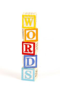 Childrens colorful blocks spell word.