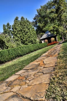 Stone path sidewalk walkway in a garden or yard.