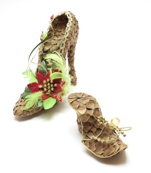 Fancy shoes made from cones over white background