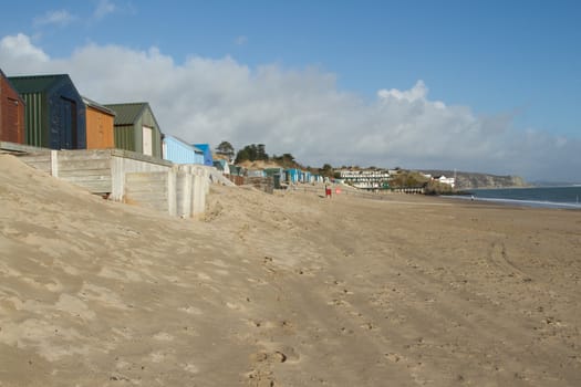 Abersoch beach, Gwynedd, North Wales, UK. Very popular tourist location with clean beach and water flanked by beach-huts.