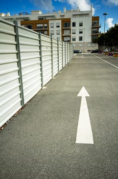 White arrow on black tarmac