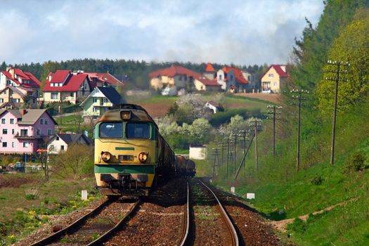 Freight diesel train climbing up the hill