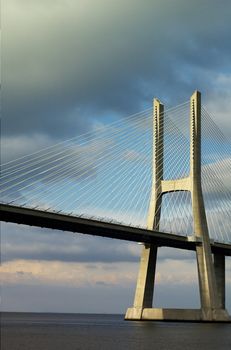 One of tye tower of Lisbon's bridge by end of day light