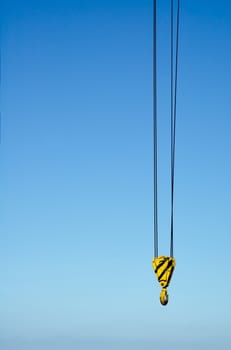 hook from crane against blue sky