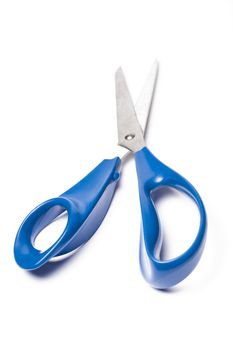 Blue metal scissors over white background