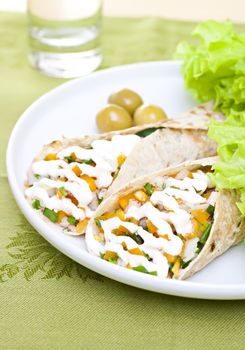 Served wheat wraps with olive, filled with salad, crab meat and mayonnaise.
