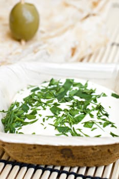 wheat bread with olive and dip.