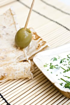 wheat bread with olive and dip.